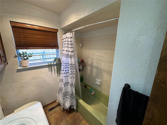 bathroom featuring tile patterned flooring and shower / bath combination with curtain