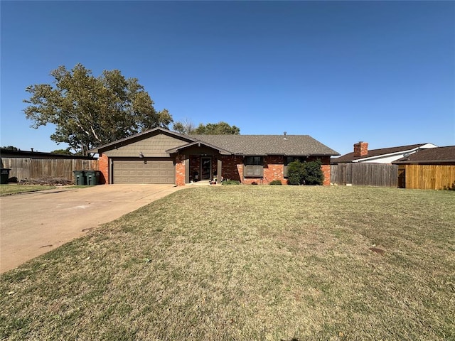 ranch-style home featuring a front yard and a garage