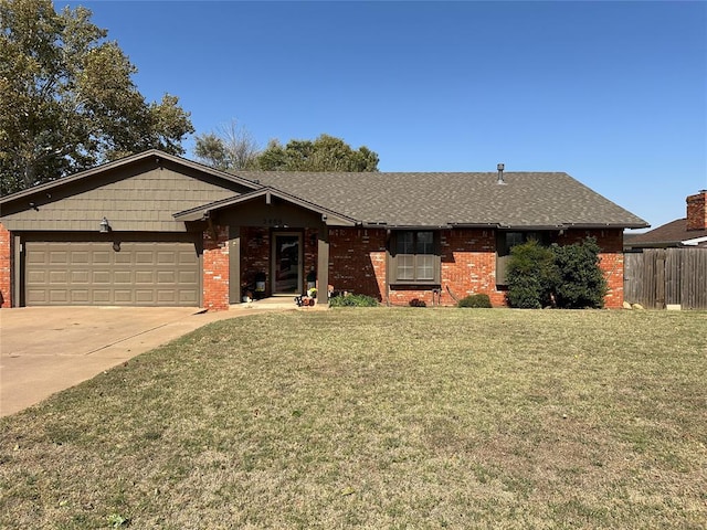 single story home featuring a front yard and a garage