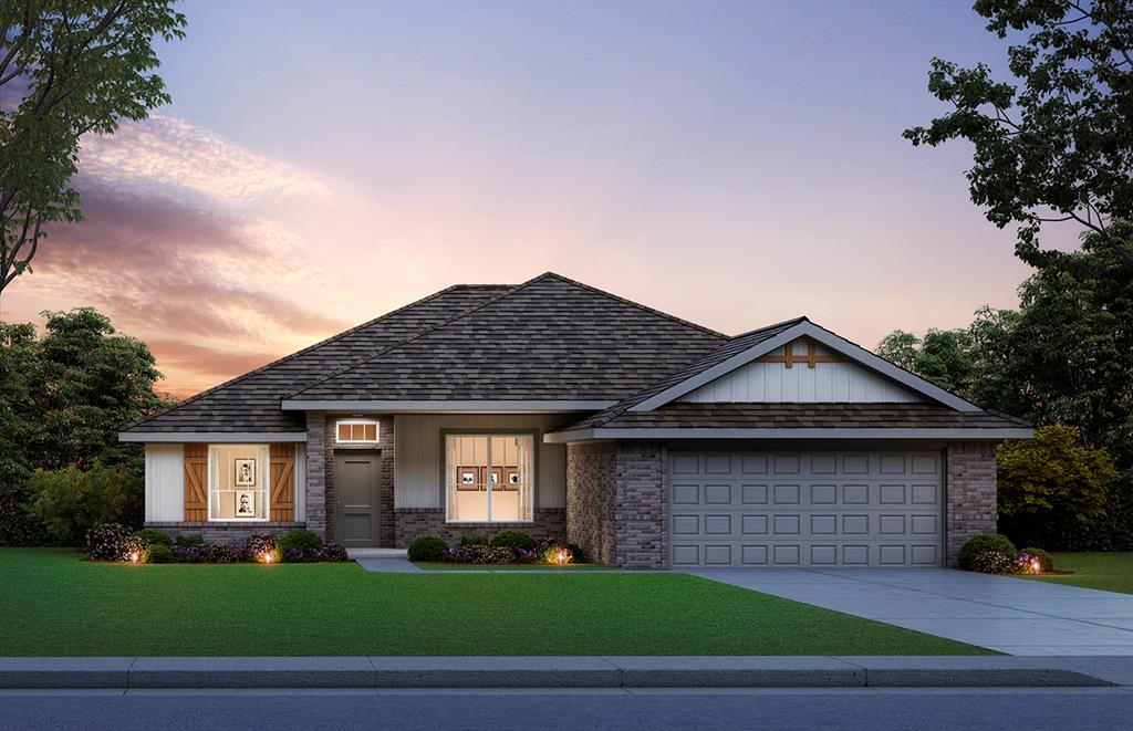 view of front facade featuring a yard and a garage