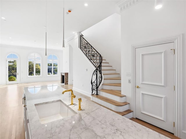 6100 NW Grand Blvd Unit 6105, Oklahoma City, OK 73118 - staircase with recessed lighting, crown molding, baseboards, and wood finished floors