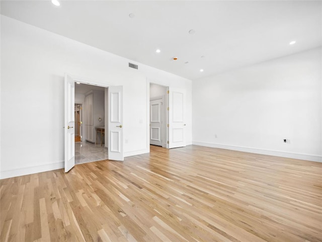 6100 NW Grand Blvd Unit 6105, Oklahoma City, OK 73118 - unfurnished room featuring light wood-type flooring, baseboards, and recessed lighting