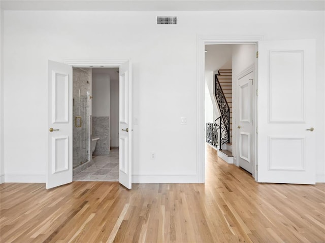 6100 NW Grand Blvd Unit 6105, Oklahoma City, OK 73118 - unfurnished bedroom with baseboards and light wood-style flooring