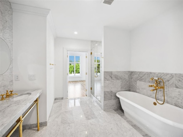 6100 NW Grand Blvd Unit 6105, Oklahoma City, OK 73118 - full bath with marble tiled flooring, vanity, a shower stall, a freestanding tub, and recessed lighting