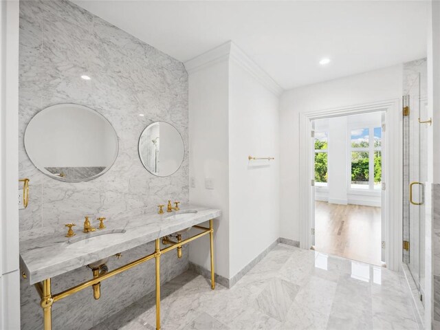 6100 NW Grand Blvd Unit 6105, Oklahoma City, OK 73118 - full bathroom featuring baseboards, double vanity, marble finish flooring, a shower stall, and ornamental molding