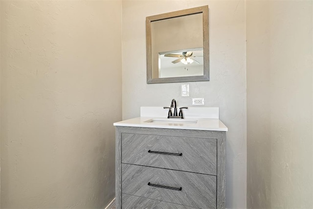 bathroom with ceiling fan and vanity