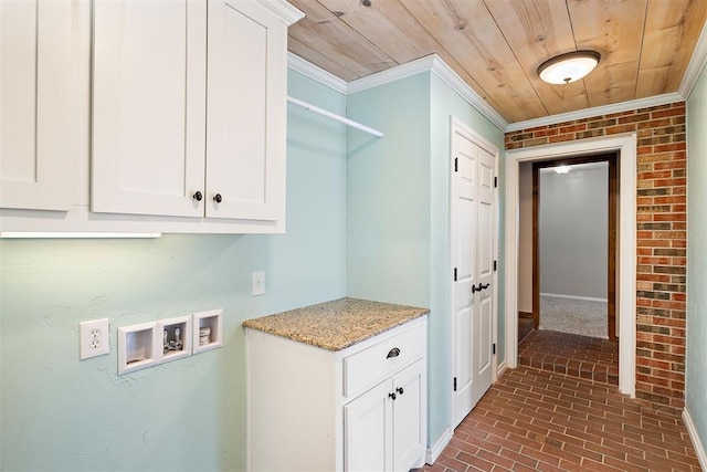 laundry room featuring cabinets, hookup for a washing machine, wooden ceiling, and crown molding