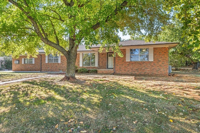 ranch-style home featuring a front yard