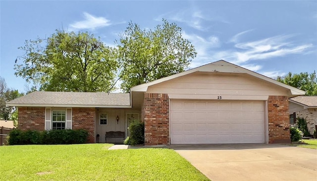 ranch-style house featuring a garage and a front yard