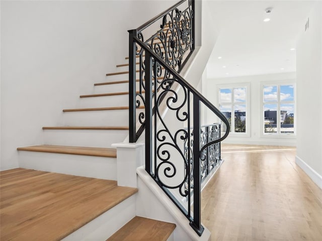 stairway with wood-type flooring