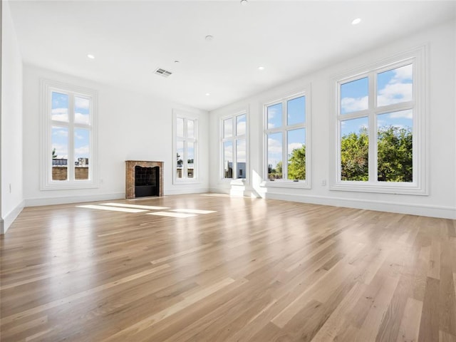 unfurnished living room with light wood-type flooring