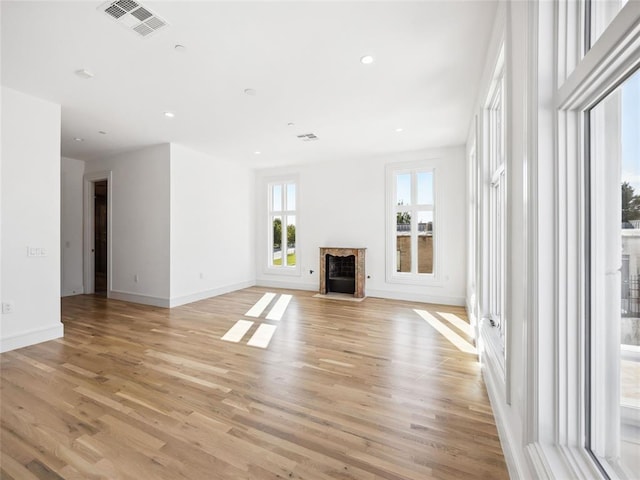 unfurnished living room with light hardwood / wood-style floors