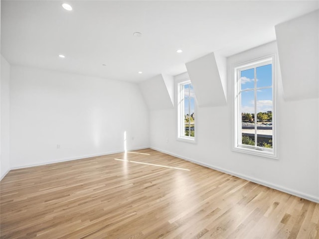 bonus room with light hardwood / wood-style floors