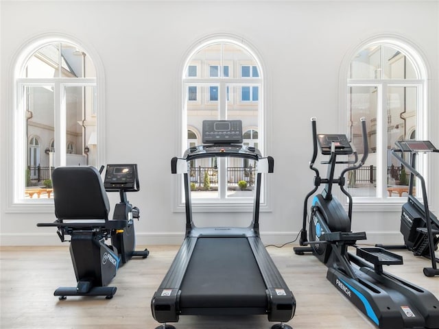 exercise area with light wood-type flooring