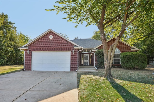 view of front facade featuring a front yard and a garage