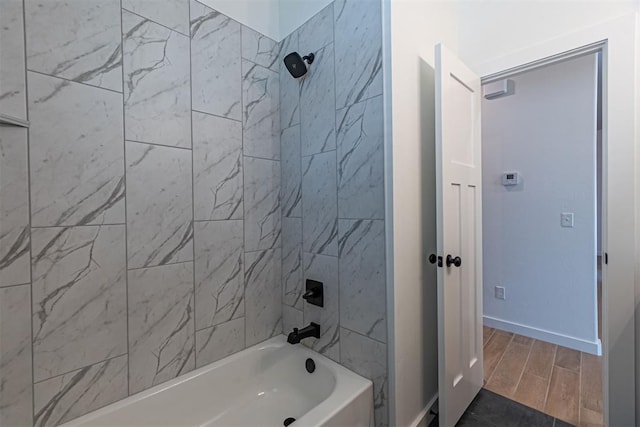 11601 SW 58th St, Mustang, OK 73064 - bathroom featuring washtub / shower combination, baseboards, and wood finished floors