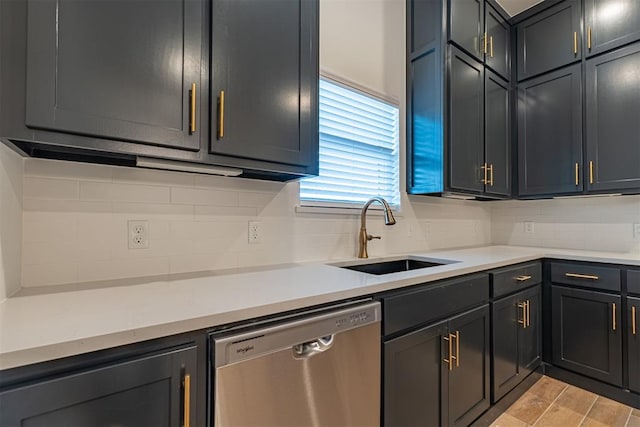 11601 SW 58th St, Mustang, OK 73064 - kitchen featuring dishwasher, a sink, backsplash, and light countertops