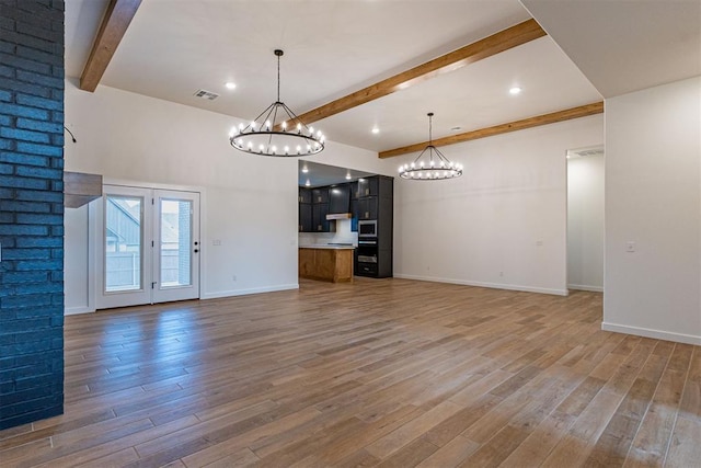 11601 SW 58th St, Mustang, OK 73064 - unfurnished living room with a chandelier, beam ceiling, light wood-style floors, baseboards, and recessed lighting