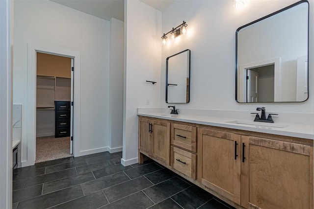 11601 SW 58th St, Mustang, OK 73064 - full bath featuring double vanity, a spacious closet, tile patterned floors, and baseboards