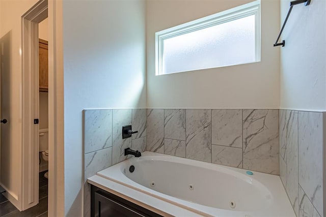 11601 SW 58th St, Mustang, OK 73064 - bathroom with a tub with jets and toilet