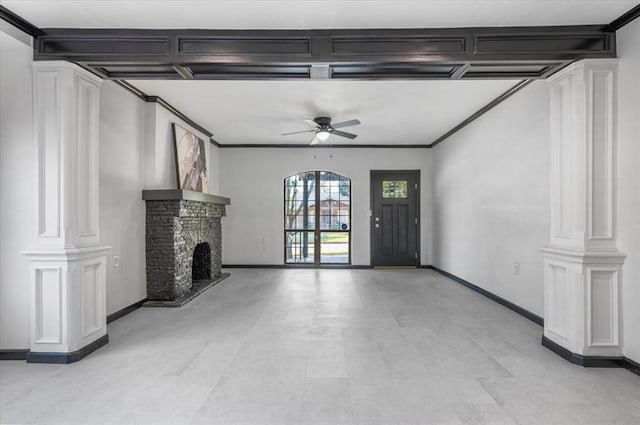 unfurnished living room featuring ornate columns, ceiling fan, and crown molding