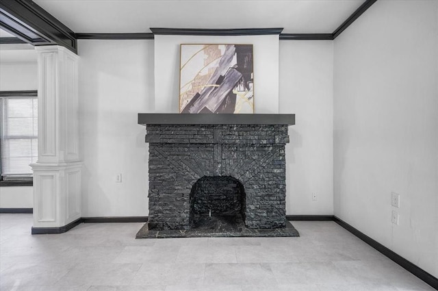 unfurnished living room with decorative columns, a stone fireplace, and crown molding