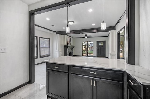 kitchen featuring kitchen peninsula, light stone countertops, ceiling fan, and pendant lighting