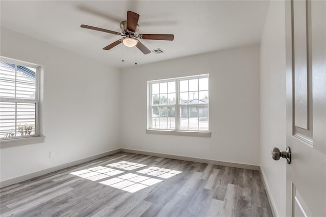 unfurnished room featuring light hardwood / wood-style flooring and ceiling fan