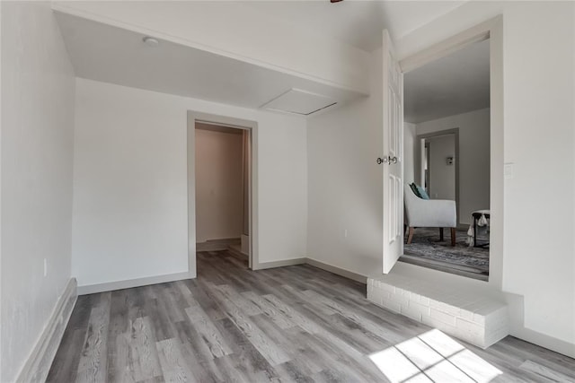 unfurnished room with light hardwood / wood-style floors