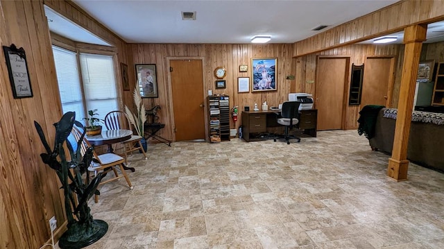 office space featuring wood walls