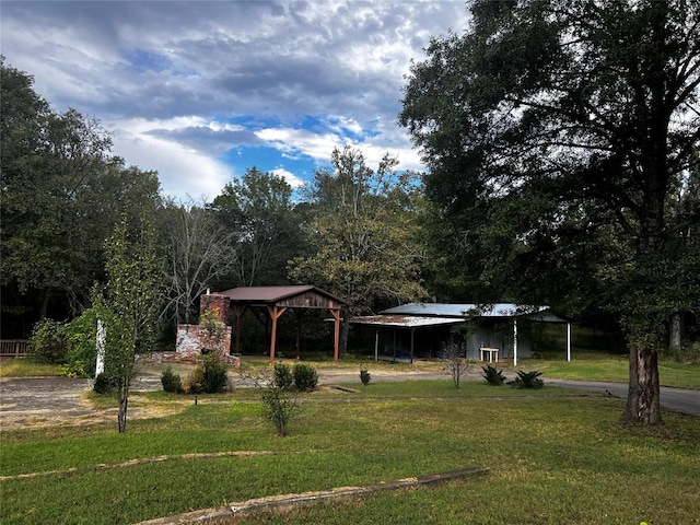 view of property's community with a yard