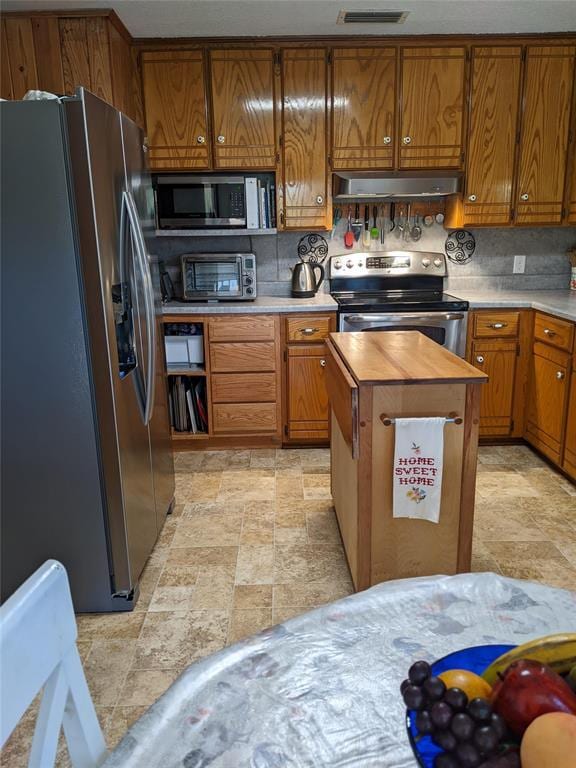 kitchen with tasteful backsplash and stainless steel appliances