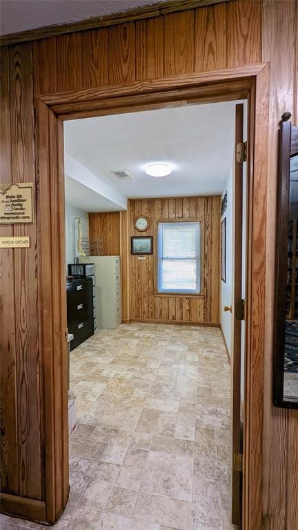 interior space featuring wood walls