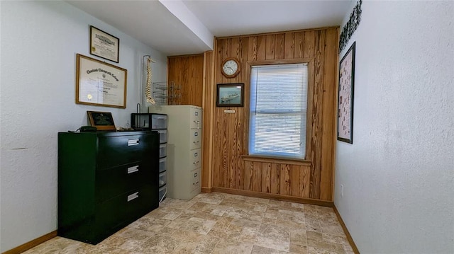 entryway with wooden walls