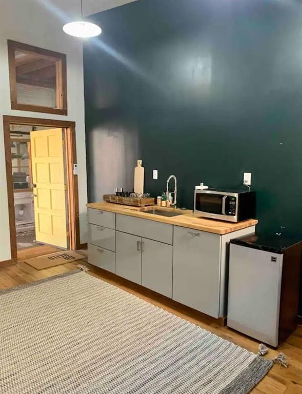 bathroom with sink and hardwood / wood-style flooring