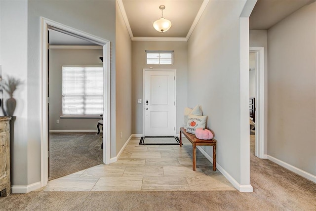 foyer entrance with crown molding and light colored carpet