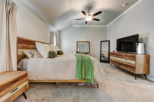 carpeted bedroom featuring vaulted ceiling, ceiling fan, and crown molding