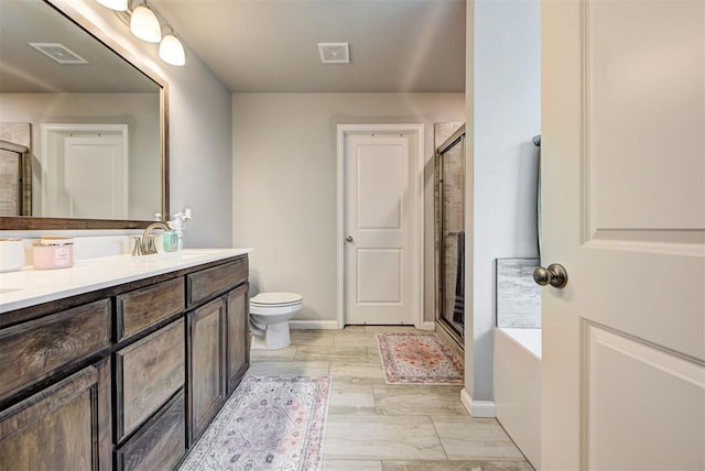 full bathroom featuring vanity, toilet, and shower with separate bathtub