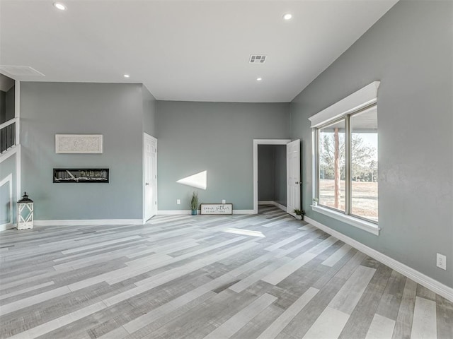 unfurnished living room featuring light hardwood / wood-style floors