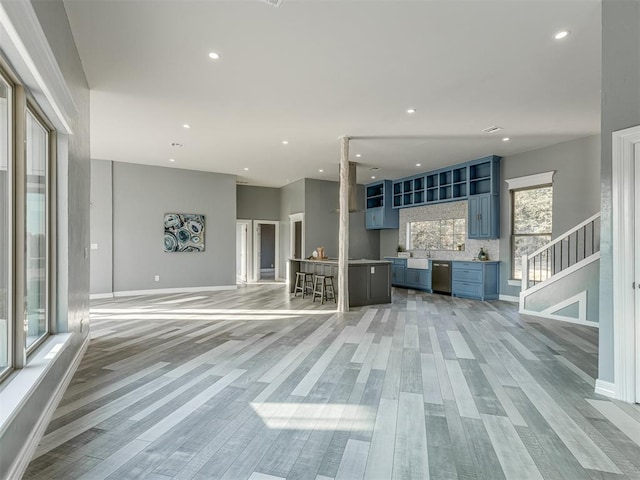 unfurnished living room featuring light wood-type flooring