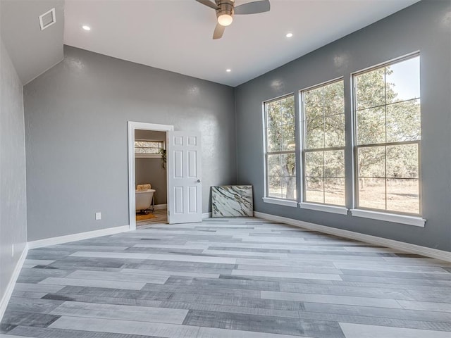 interior space featuring a wealth of natural light, ceiling fan, and light wood-type flooring