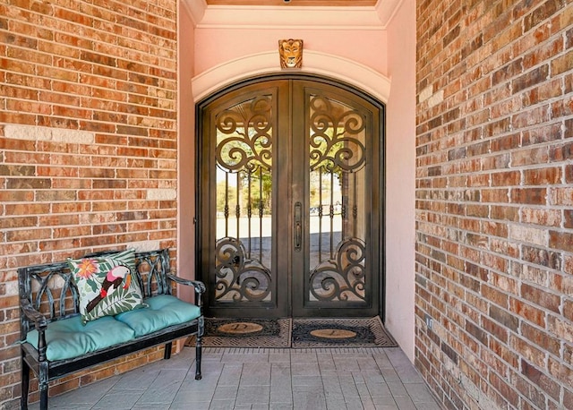 view of exterior entry featuring french doors