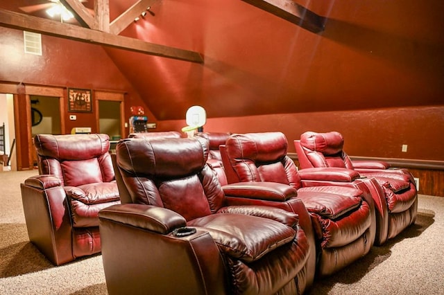 cinema with carpet flooring and lofted ceiling