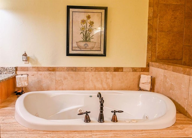 bathroom with a relaxing tiled tub