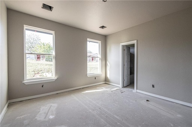 unfurnished room featuring a healthy amount of sunlight