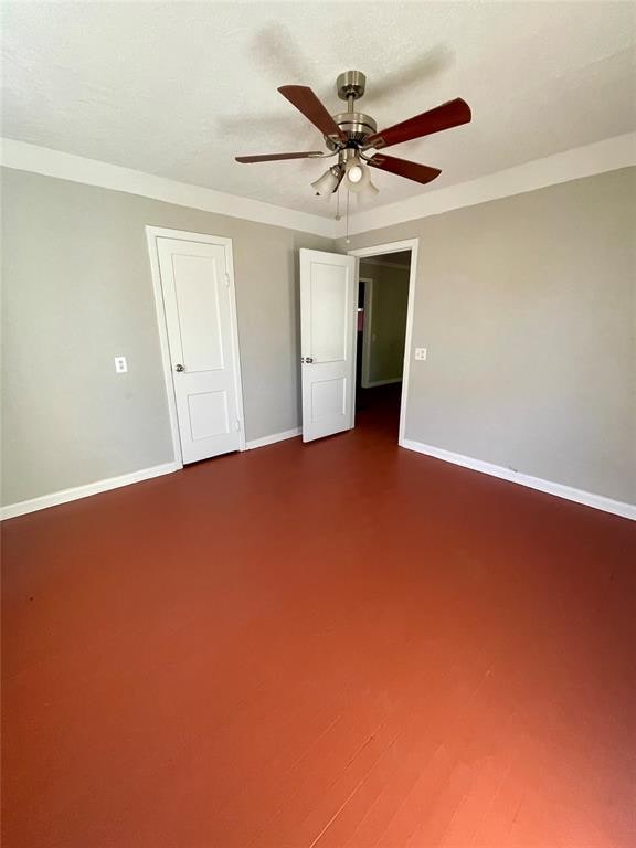 unfurnished bedroom featuring ceiling fan and wood-type flooring