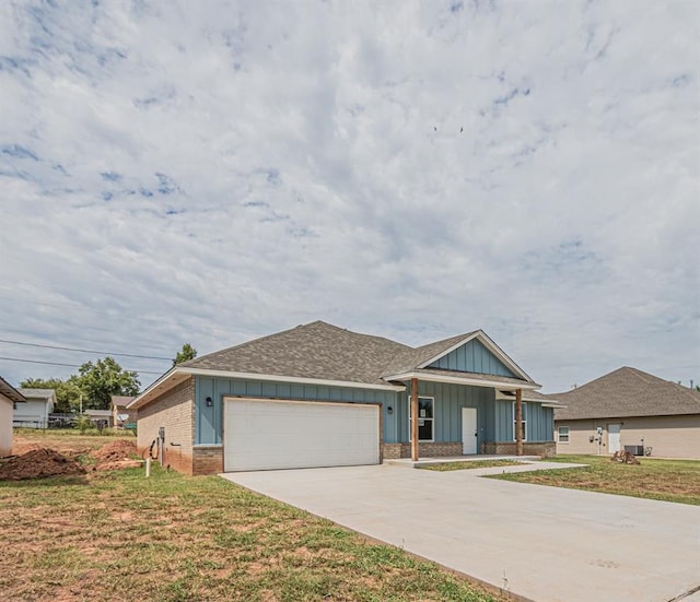 view of front facade with a front yard and a garage