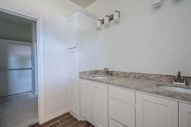 bathroom with hardwood / wood-style flooring and vanity