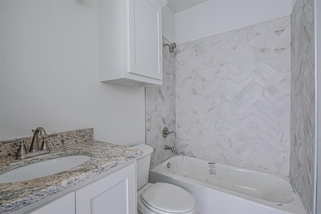 full bathroom featuring vanity, toilet, and tiled shower / bath