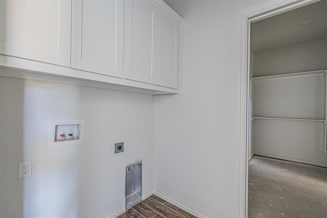 laundry room with cabinets, hookup for a washing machine, dark hardwood / wood-style flooring, and electric dryer hookup